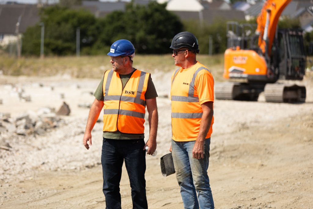 _33A7645 Two demolition contractors in Cornwall chatting about a project