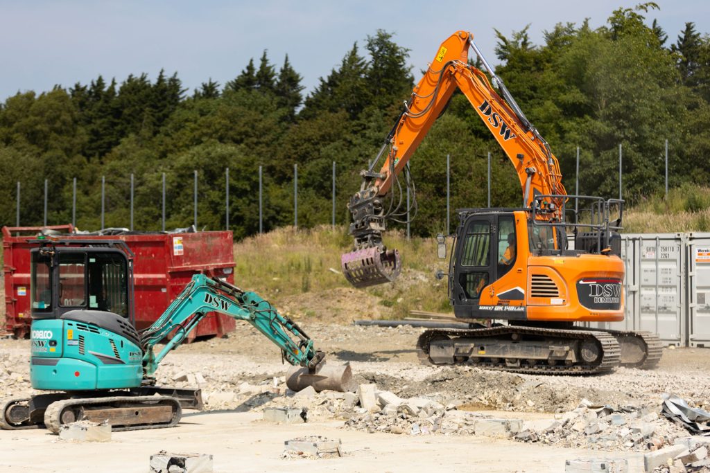 _33A7816 Various excavators in demolition site in East Cornwall
